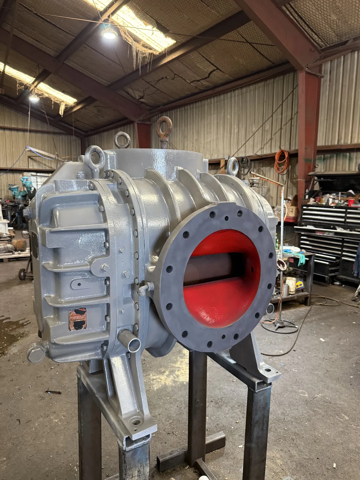 Industrial blower housing in primer during rebuild at KMS